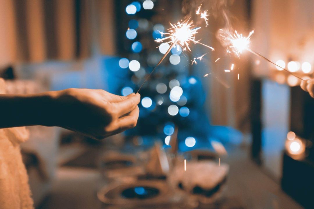 Sparklers by a festive dinner table