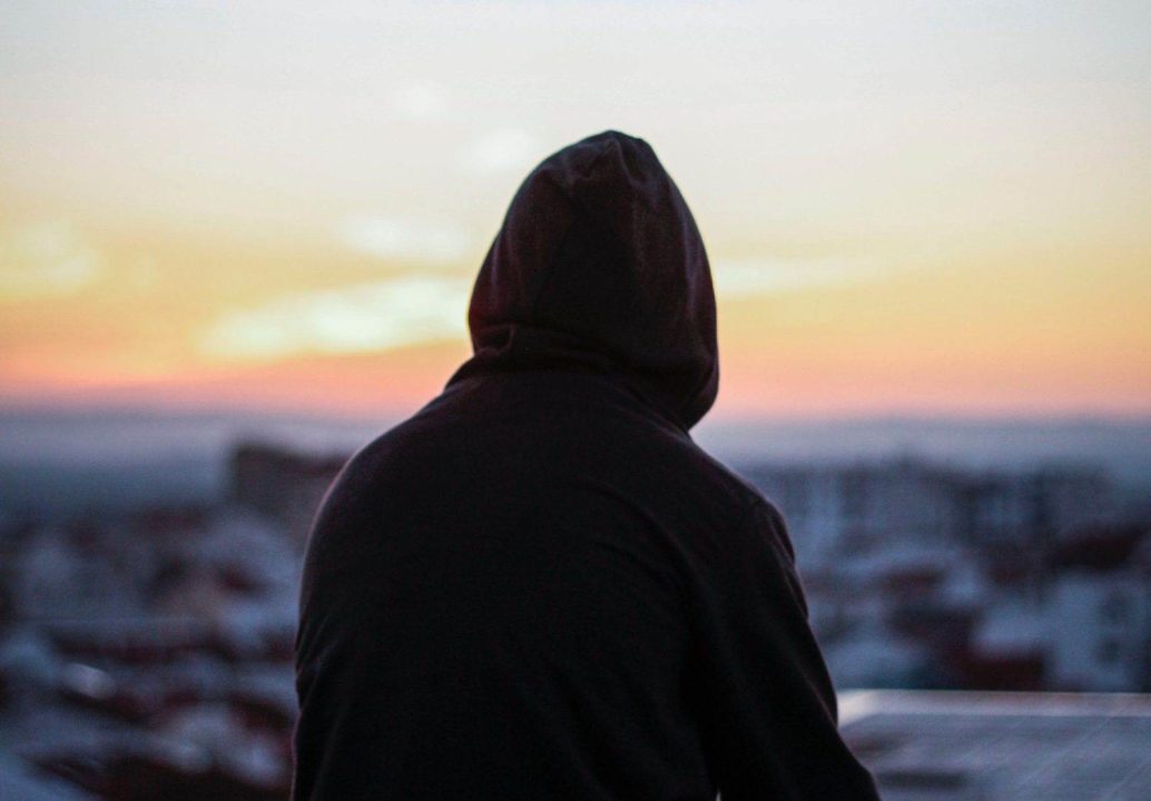 Person looking out at the sunset