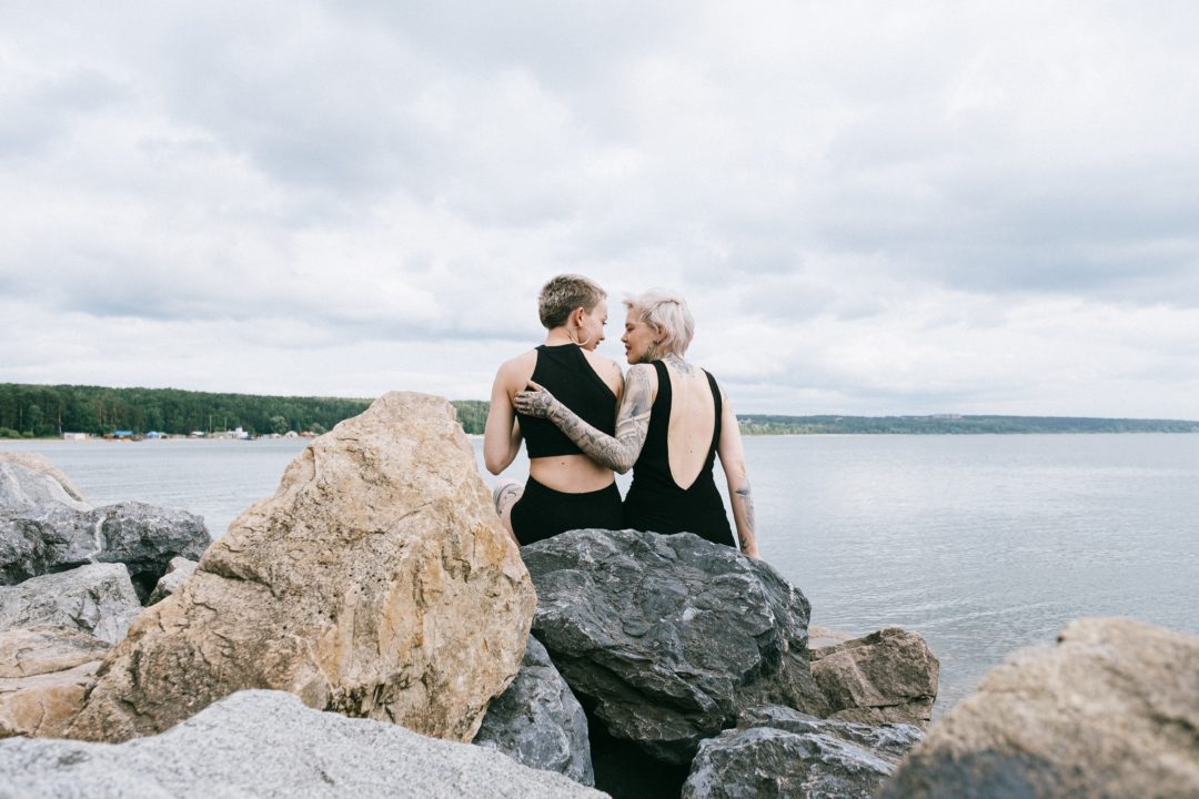 Two people by a lake