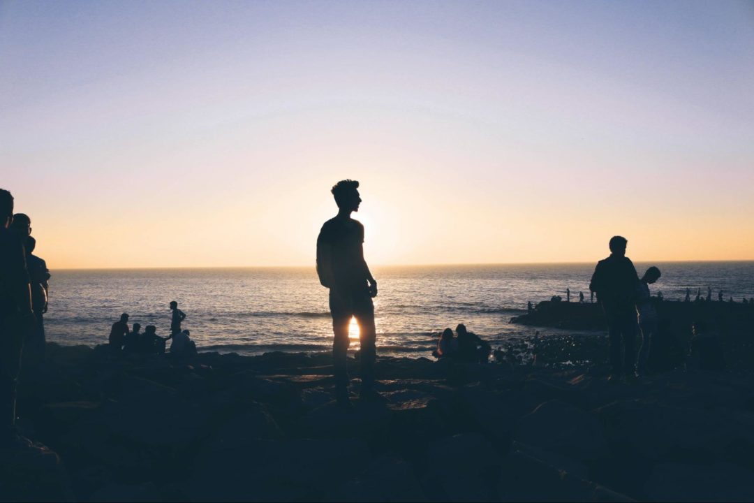 Man at beach at sunset