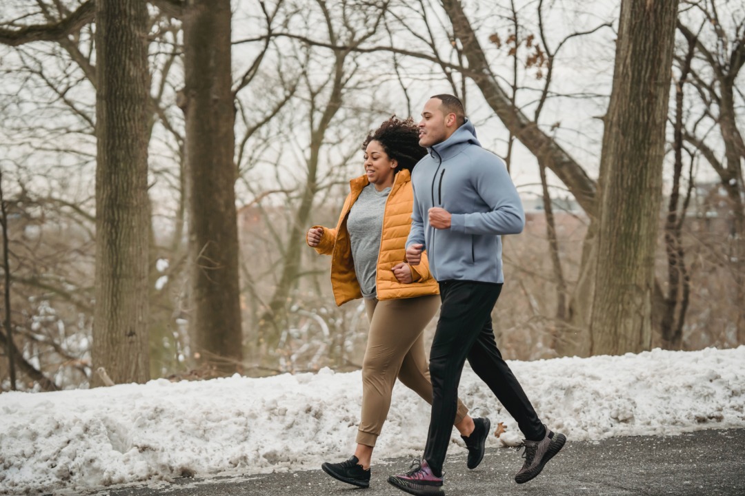 Two people going for a run in the winter