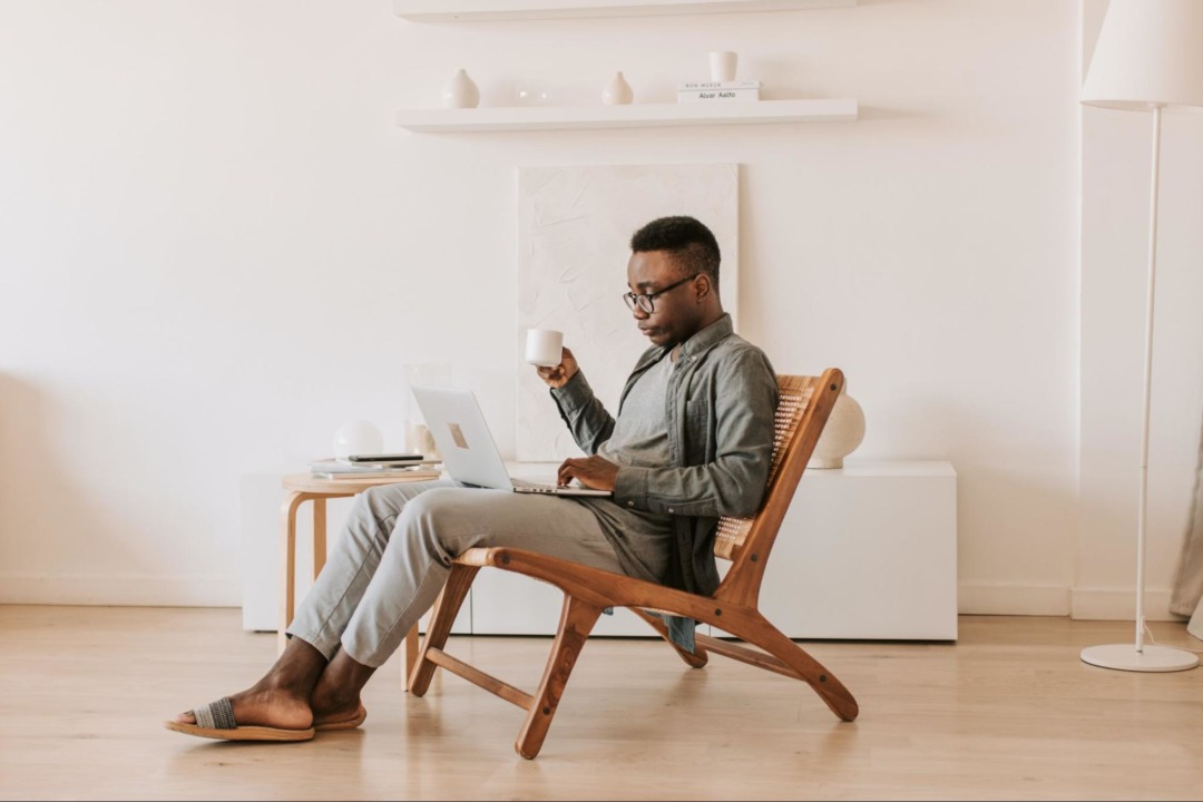 man on computer in living room