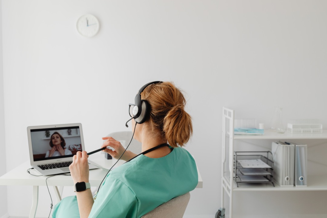 Doctor on computer at desk