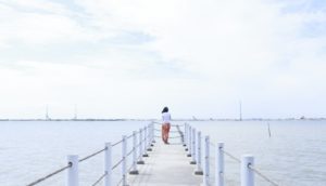 person standing on a dock