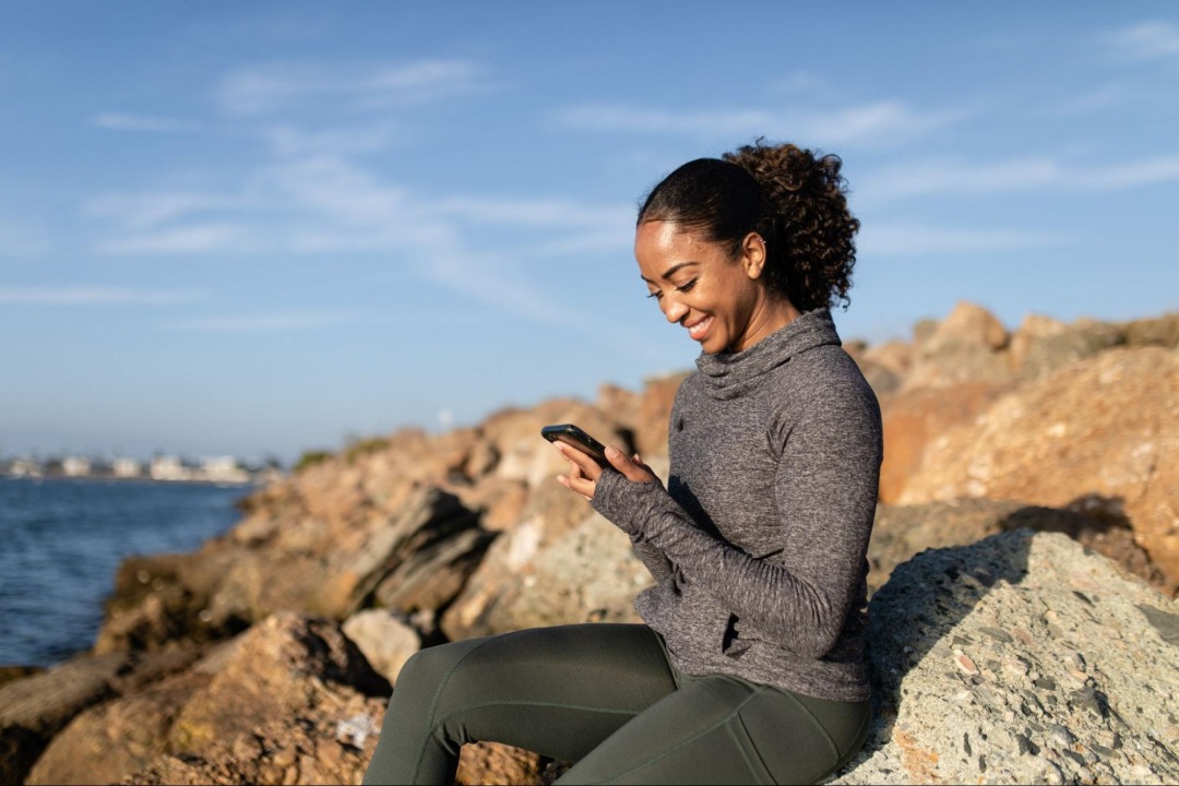 Woman on phone by water